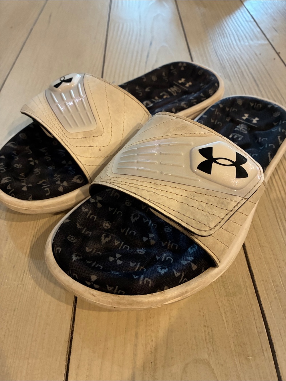 White and black under armor slides